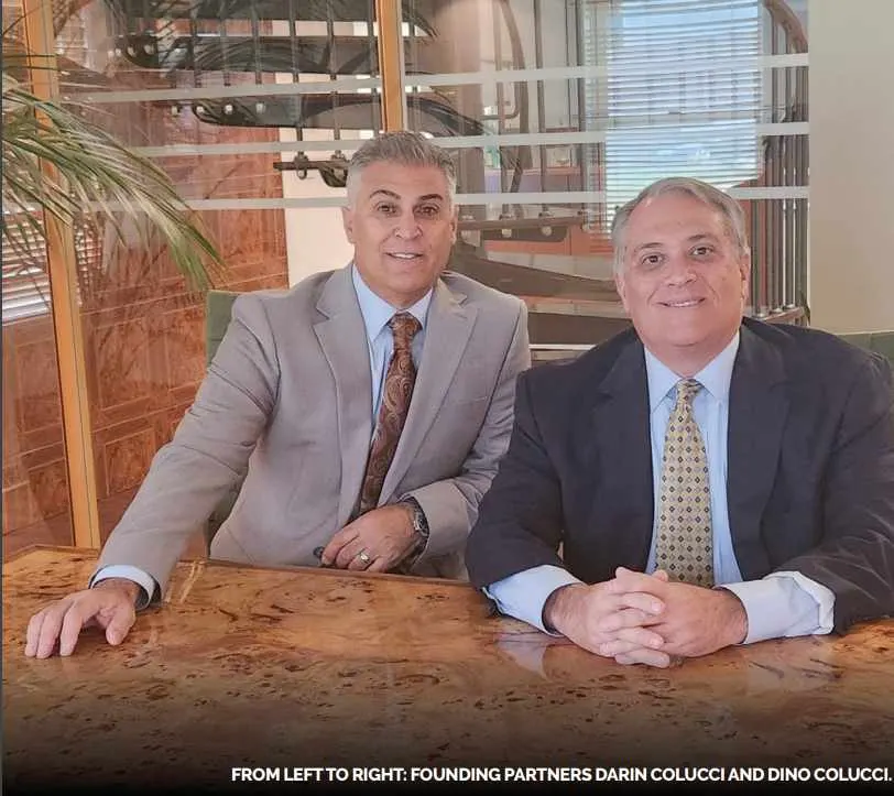 Darin and Dino Colucci sitting at a table.